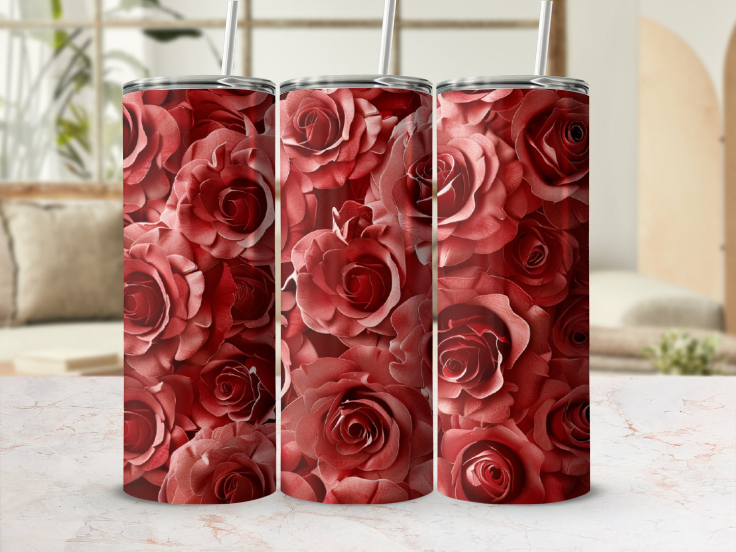 Three tumblers covered in a pattern of red roses.