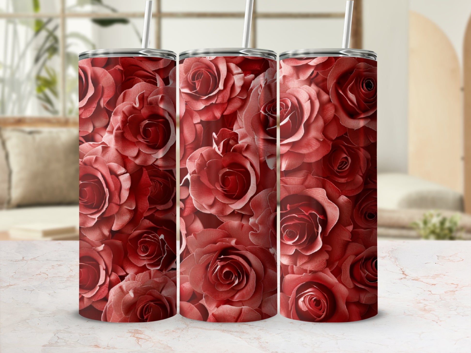 Three tumblers covered in a pattern of red roses.