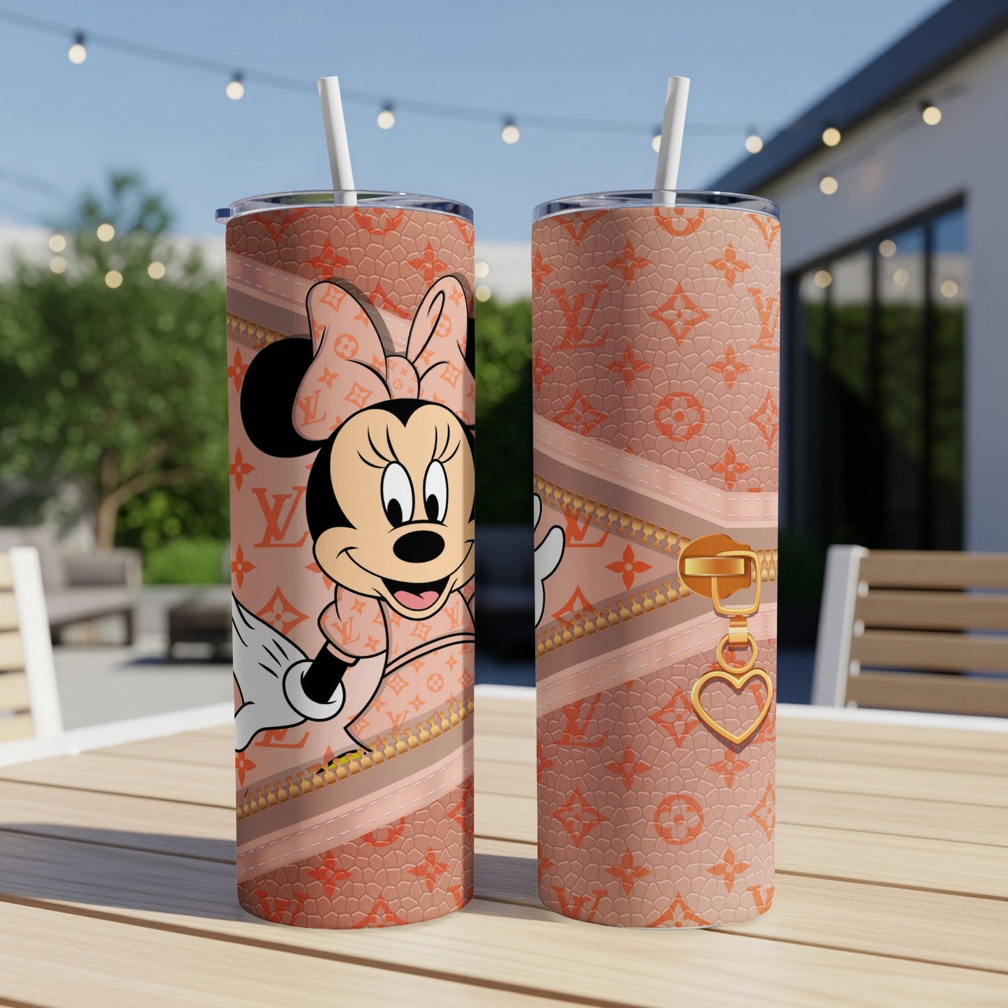 Minnie Mouse tumbler with a designer pattern and gold zipper detail.