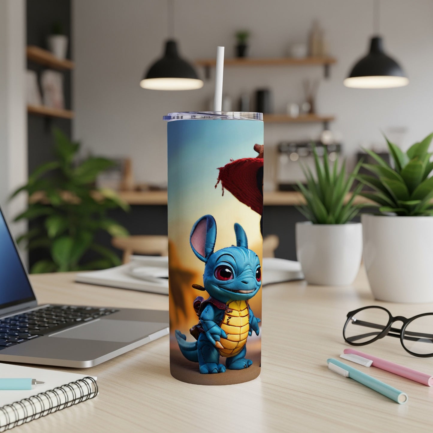 Blue cartoon dragon character on a blue tumbler with a straw.