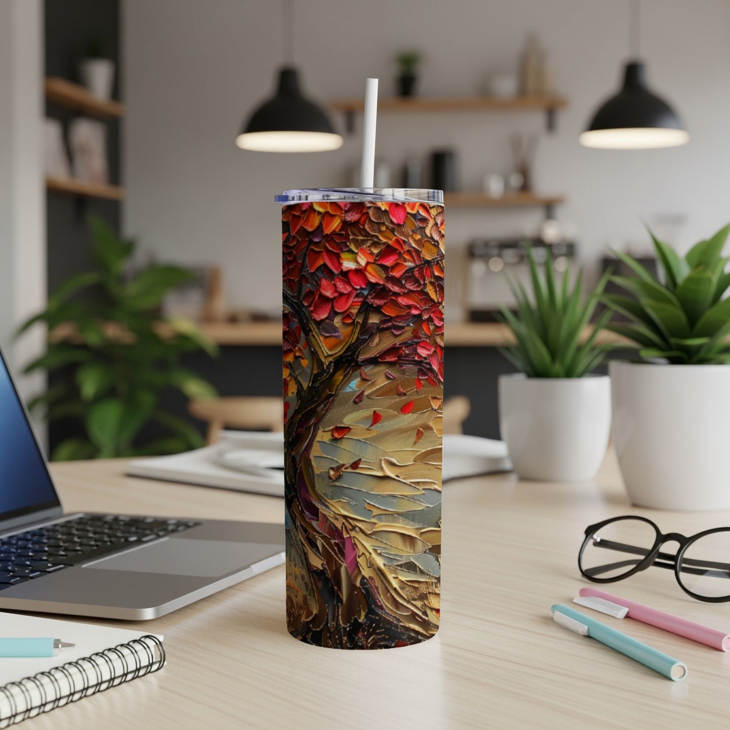 Tall tumbler with a textured red and orange abstract tree design.