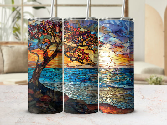 Triptych tumbler wraps depict a tree over a textured ocean at sunset.