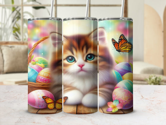 Kitten with Easter eggs and butterflies on a tumbler.
