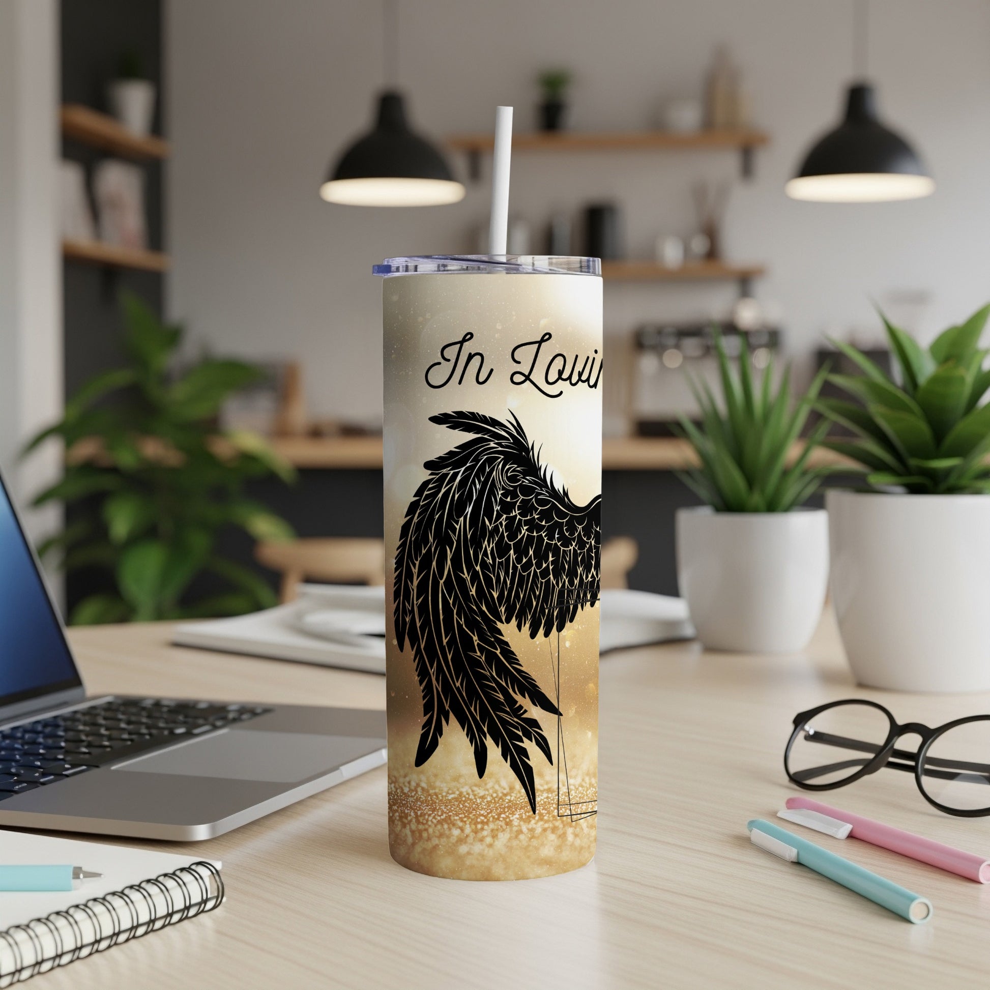 Tumbler with "In Loving" text and black angel wings on a sparkling background.