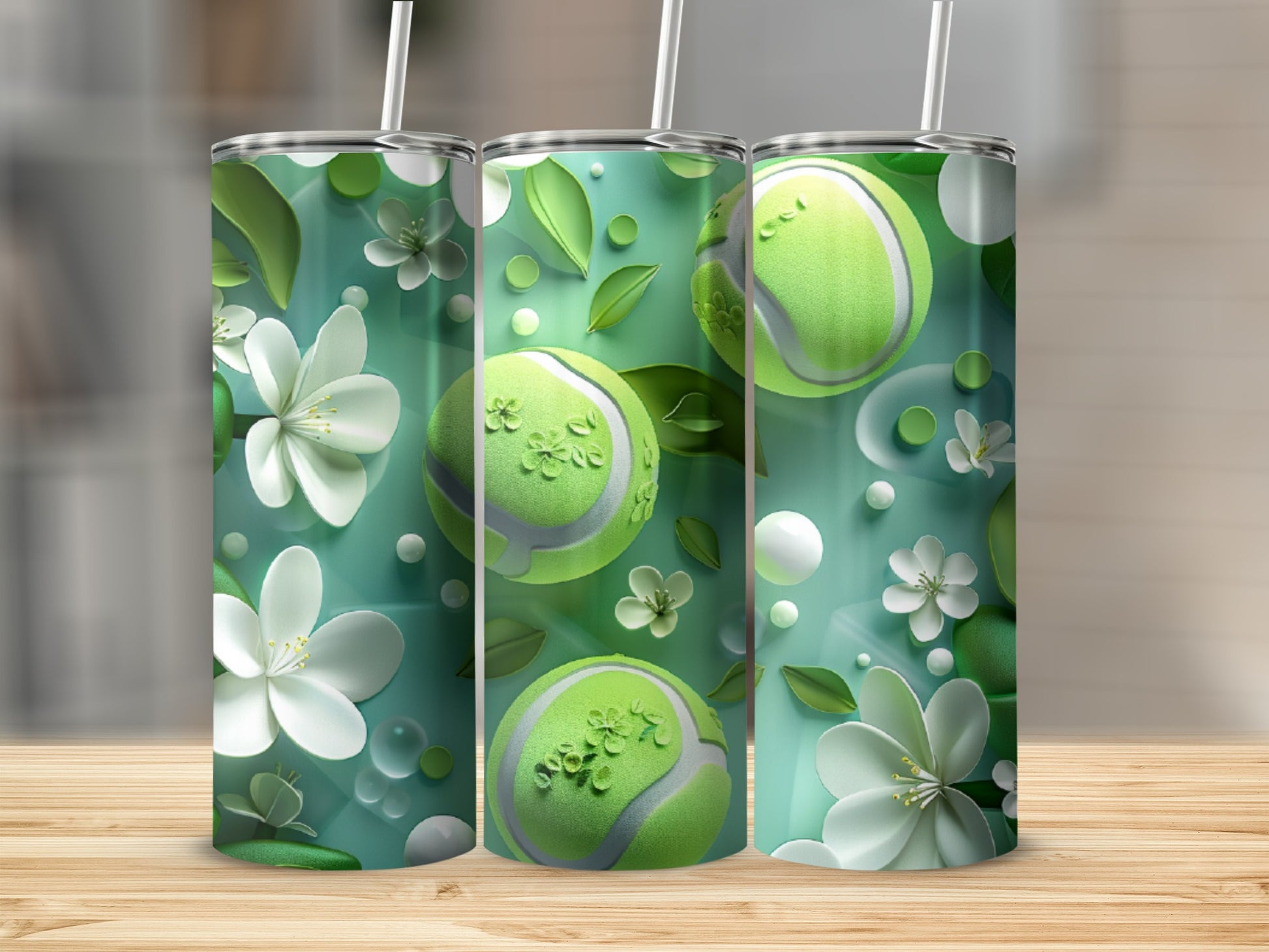 Three green tennis balls with flowers and leaves on a mint green background.