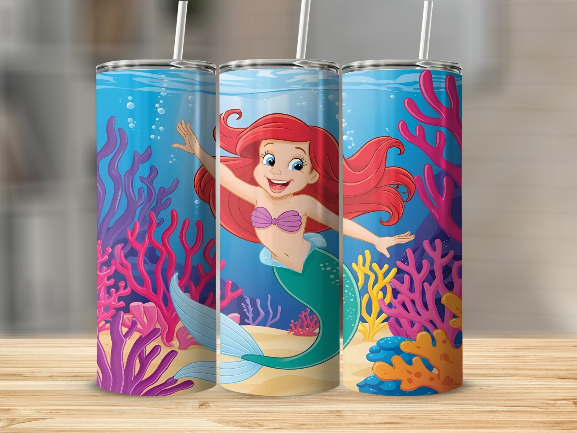 Ariel the mermaid smiling underwater with colorful coral and plants.