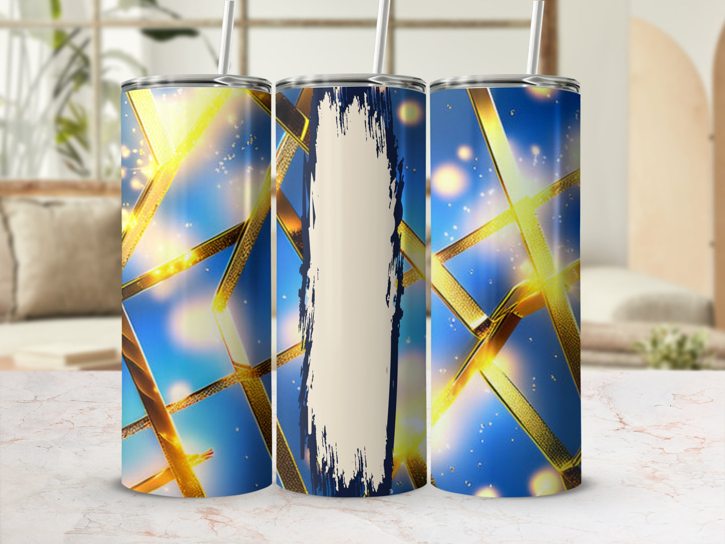 Three tumblers with a gold ribbon and blue sparkle design.