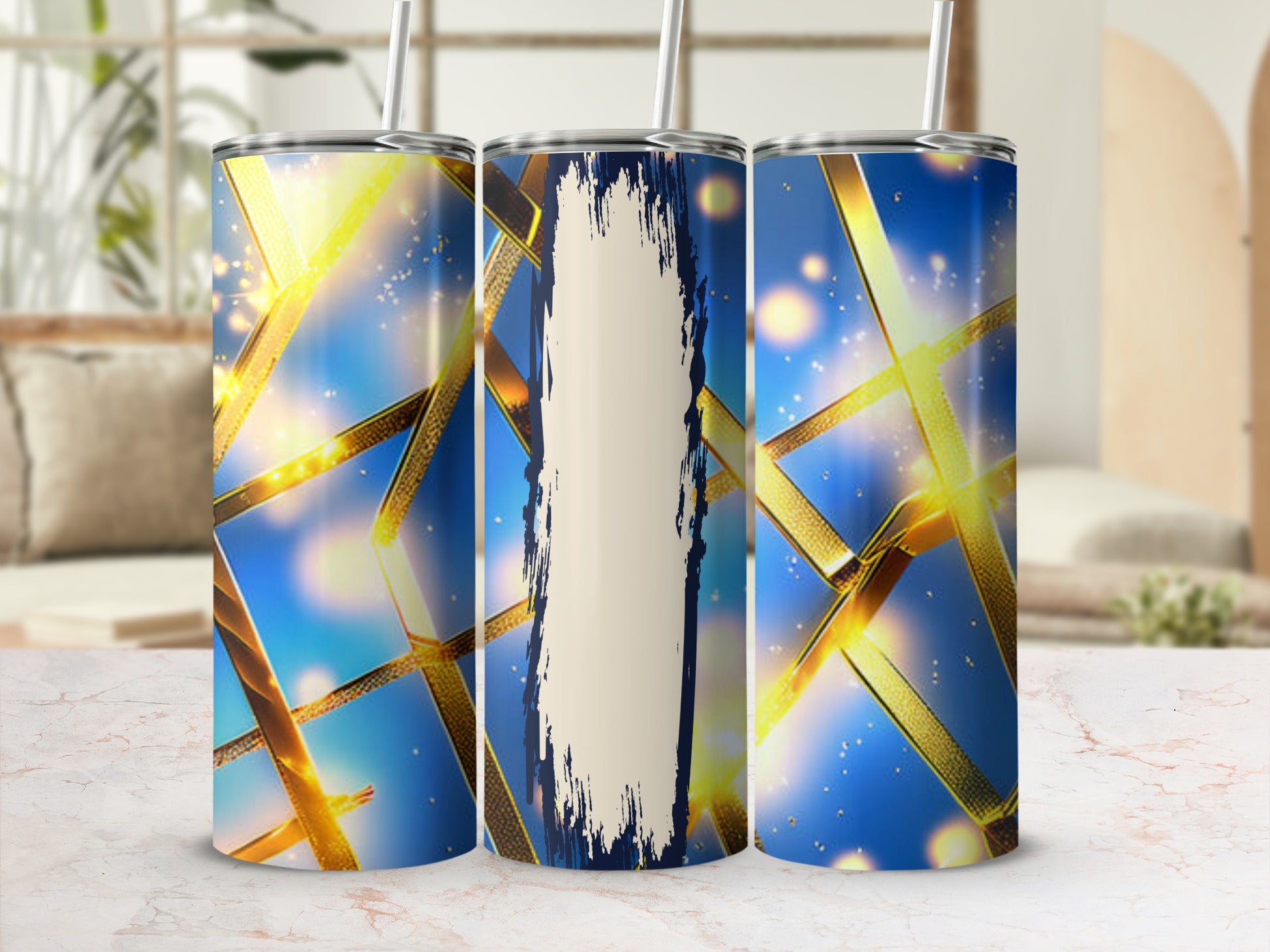 Three tumblers with a gold ribbon and blue sparkle design.