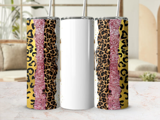 White tumbler with leopard and glitter patterns, on a marbled surface.