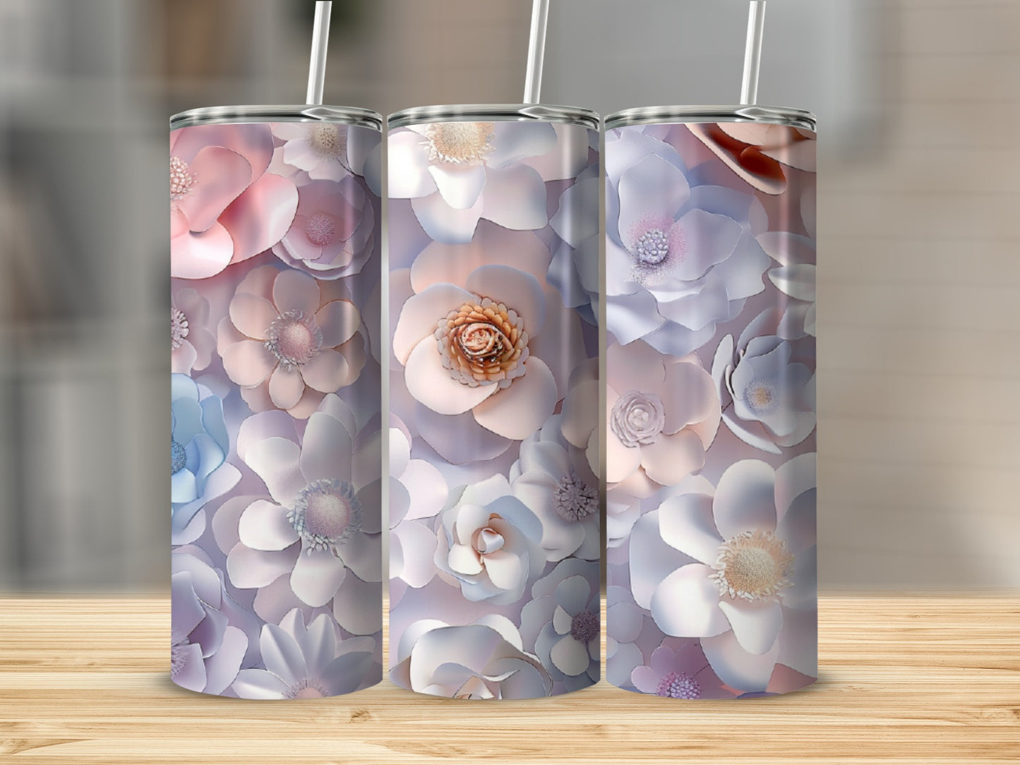 Three tumblers decorated with pastel floral patterns.