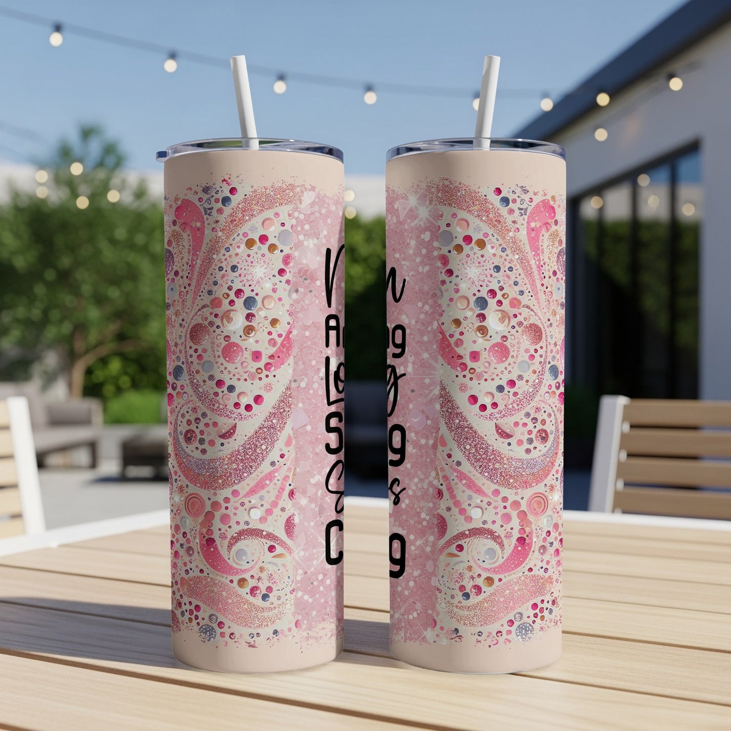 Pink paisley pattern tumbler with black text.