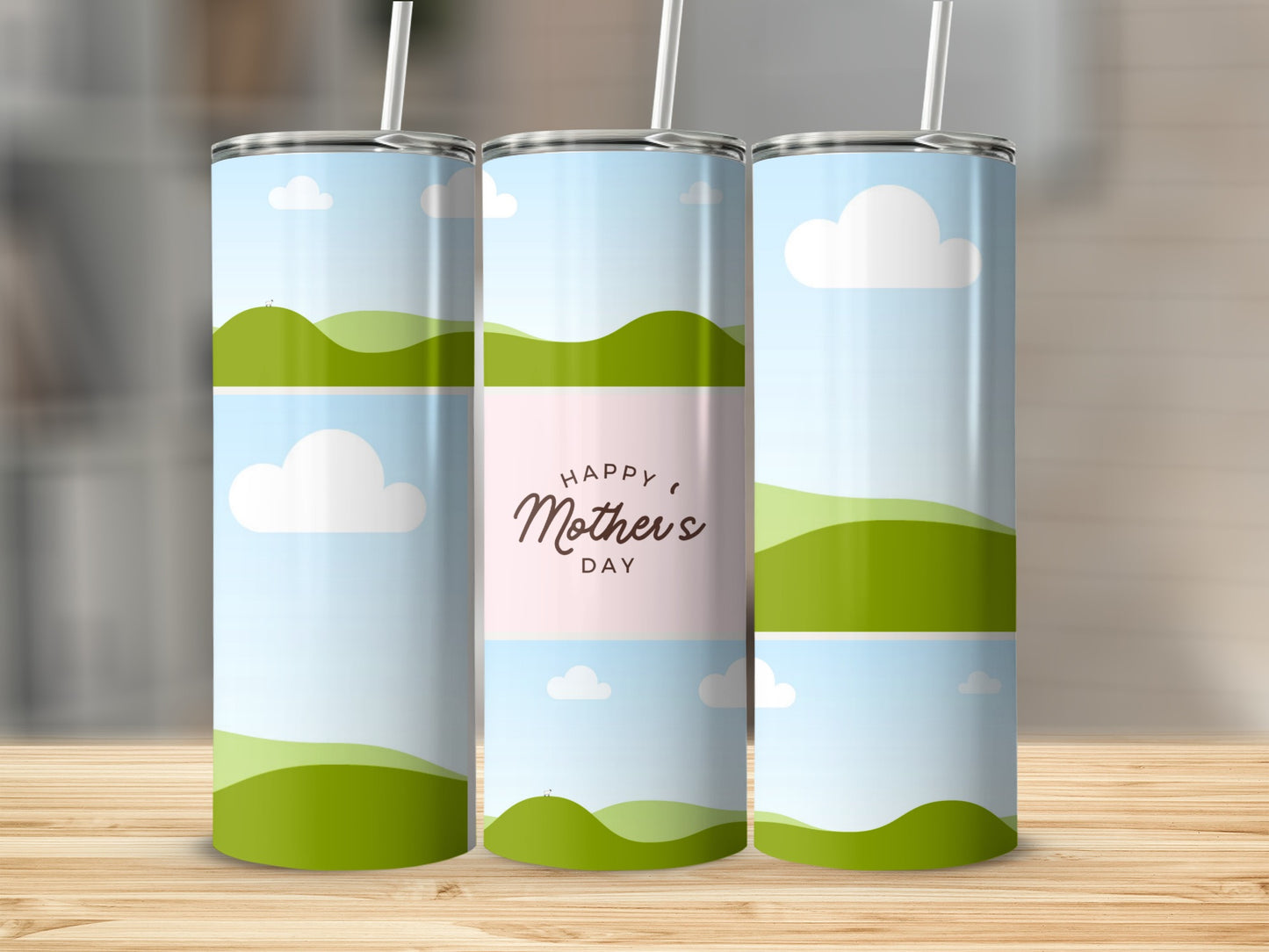 Three tumblers with "Happy Mother's Day" text and a rolling green hills and sky design.