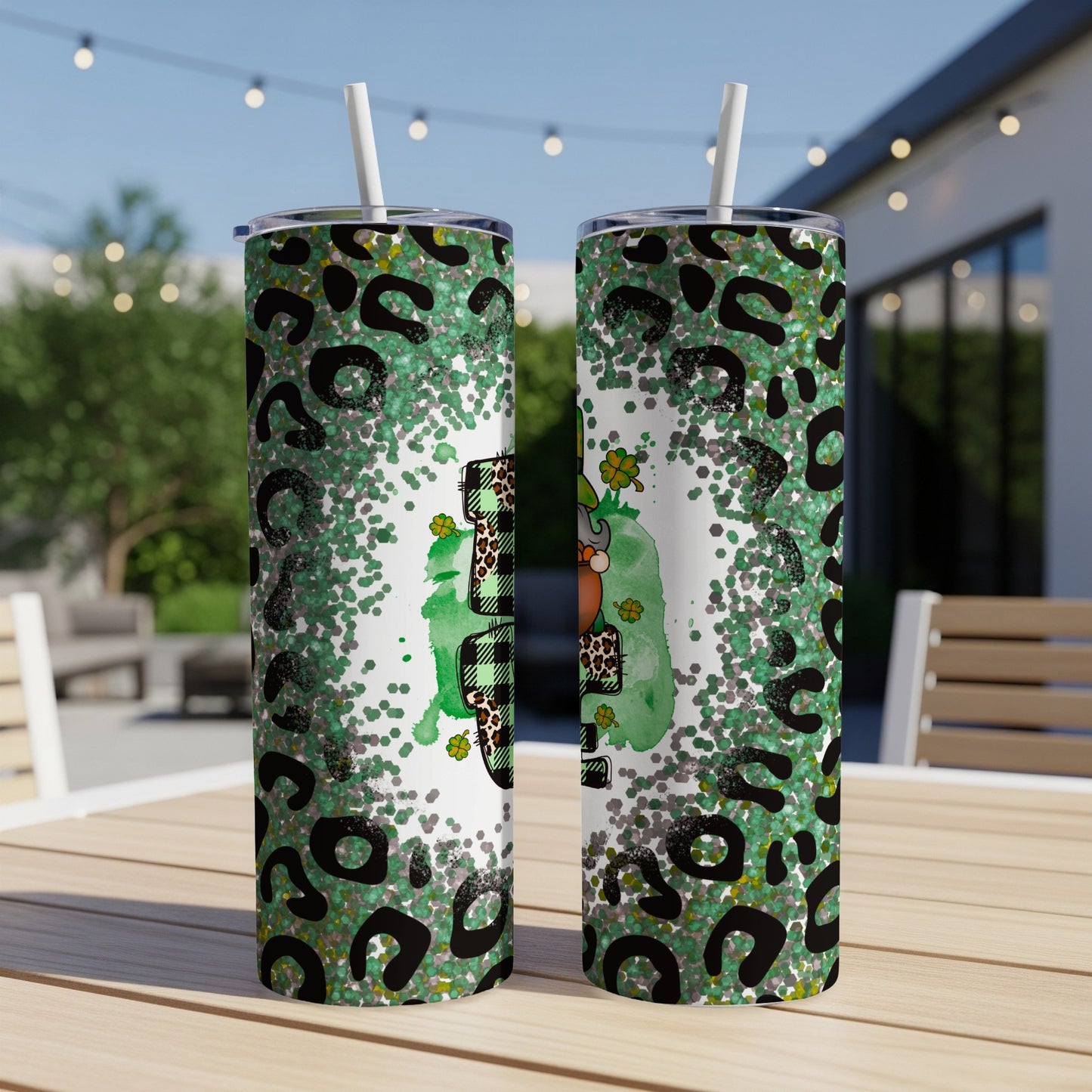 Two green tumblers with leopard print and glitter, featuring a shamrock and pot of gold.