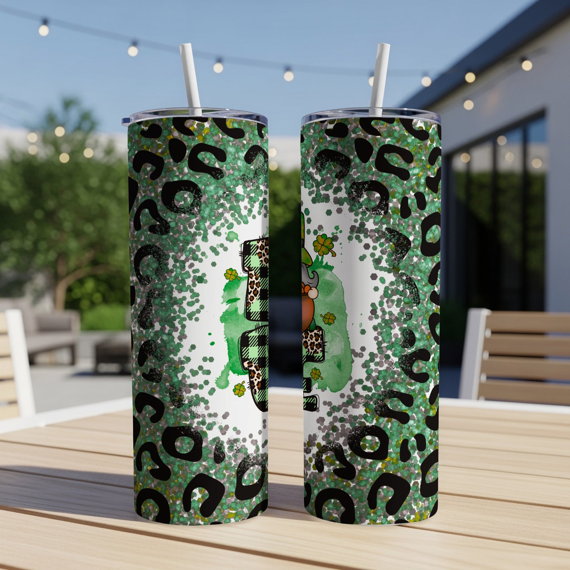 Two green tumblers with leopard print and glitter, featuring a shamrock and pot of gold.