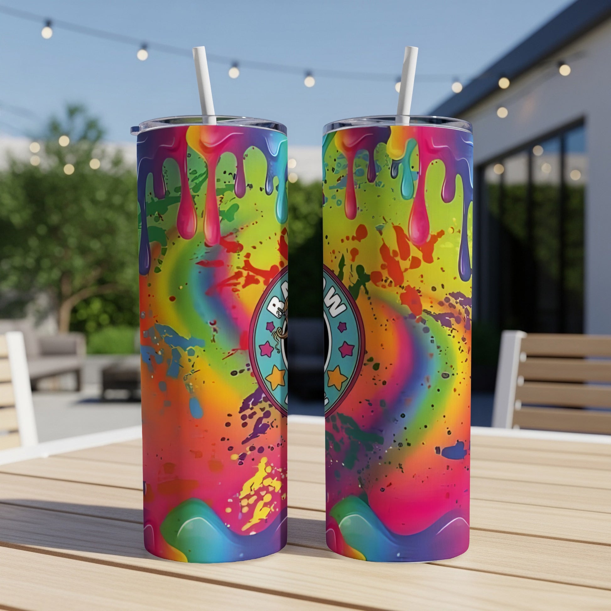 Two colorful skinny tumblers with drip design and cartoon logo.
