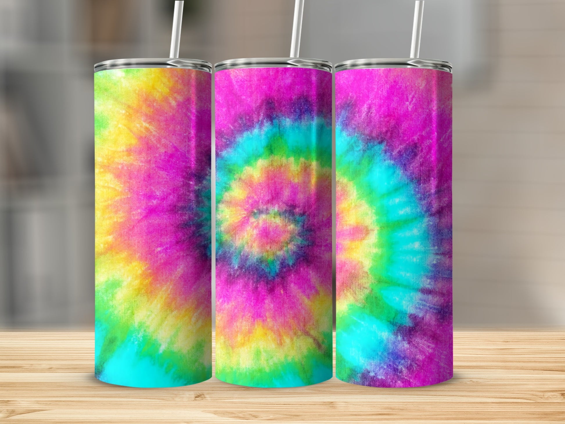 Three tumblers with colorful tie-dye patterns.