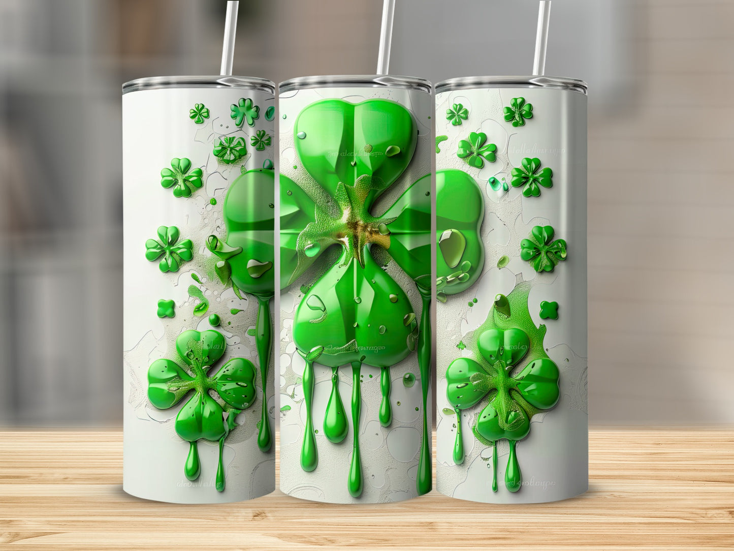 Three green shamrocks with dripping paint on white tumblers.