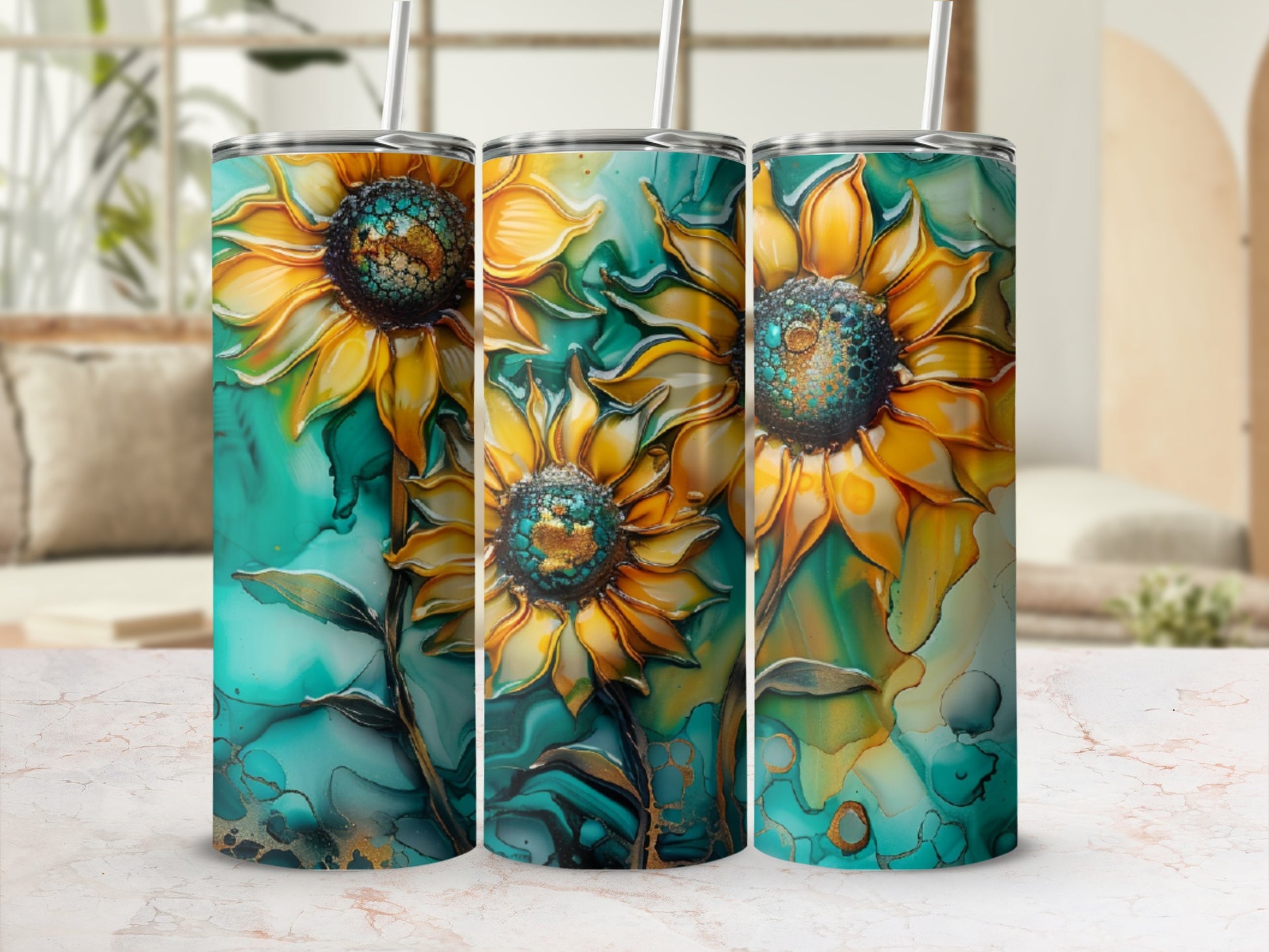 Three tumblers with abstract sunflower designs on a marbled surface.