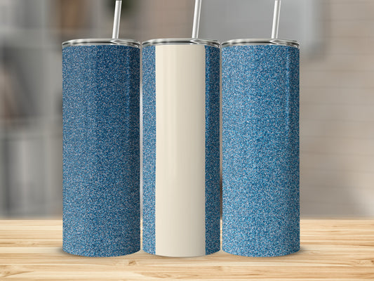 Three glitter-covered tumblers with straws on a wooden surface.
