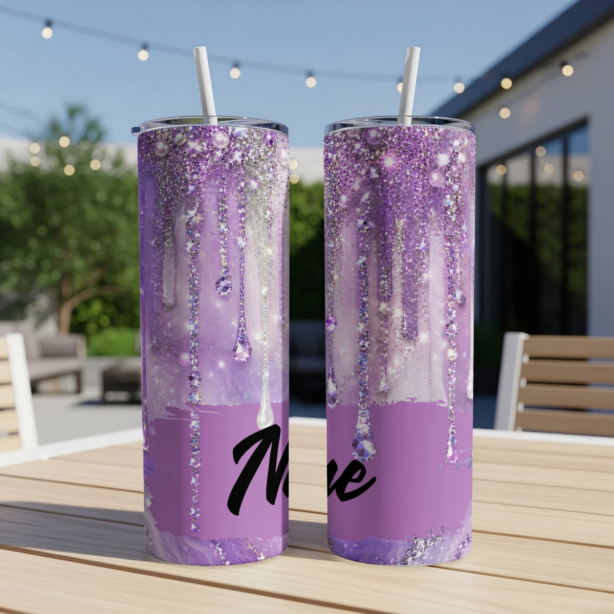 Two purple glitter tumblers with hanging jewel and drip designs, one shows "Ne".