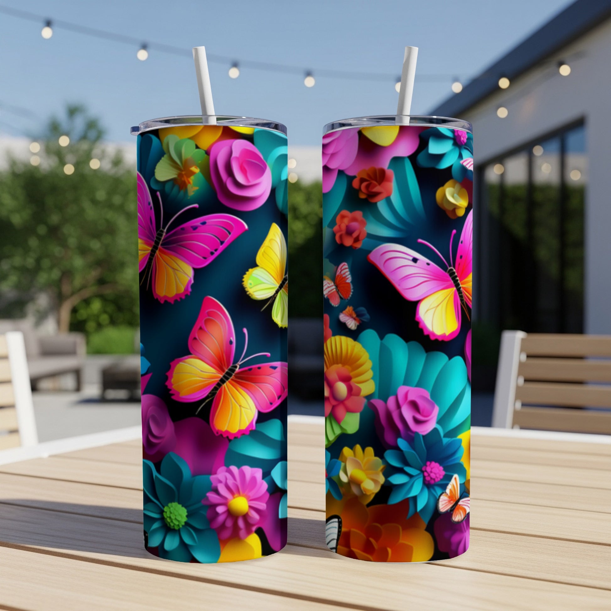 Two tumblers with colorful floral and butterfly designs.