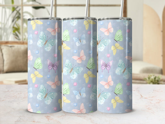 Pastel butterflies and hearts pattern on three insulated tumblers.