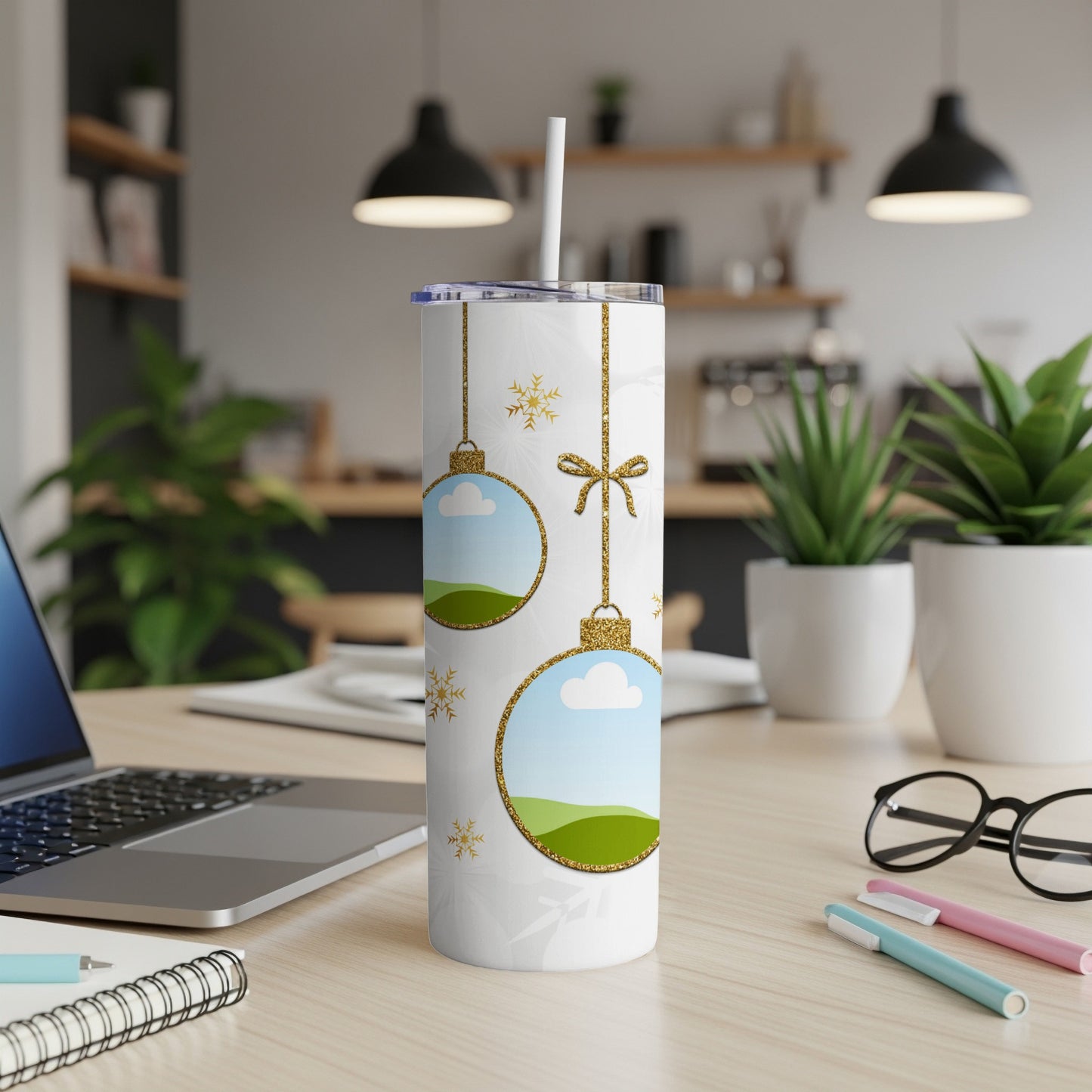 White tumbler with Christmas ornament design and gold glitter accents.