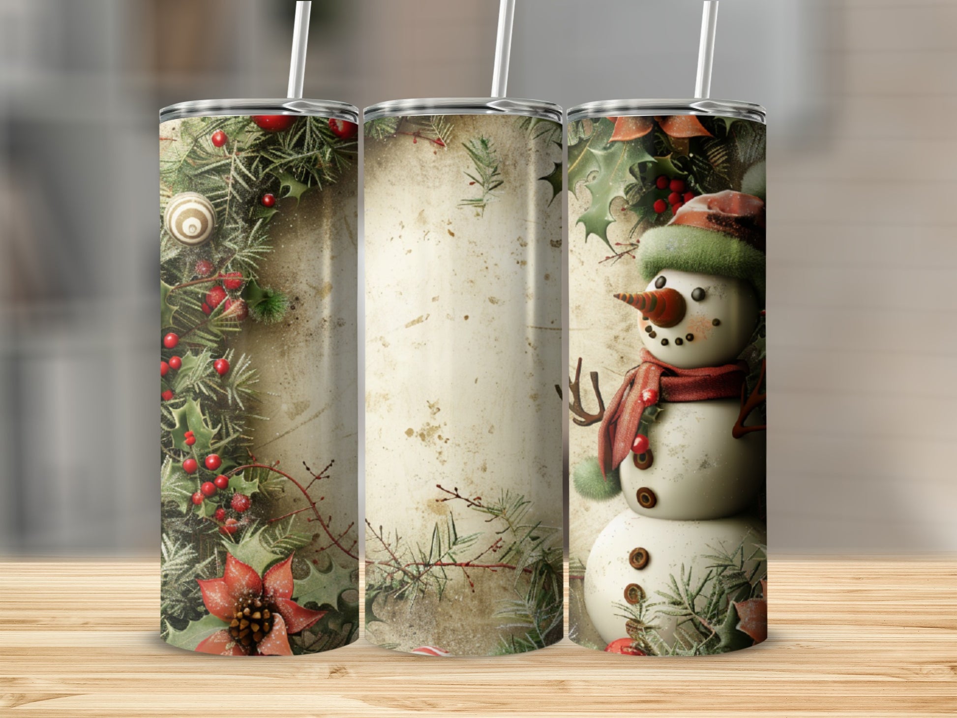 Three tumblers with a festive snowman and holly design.