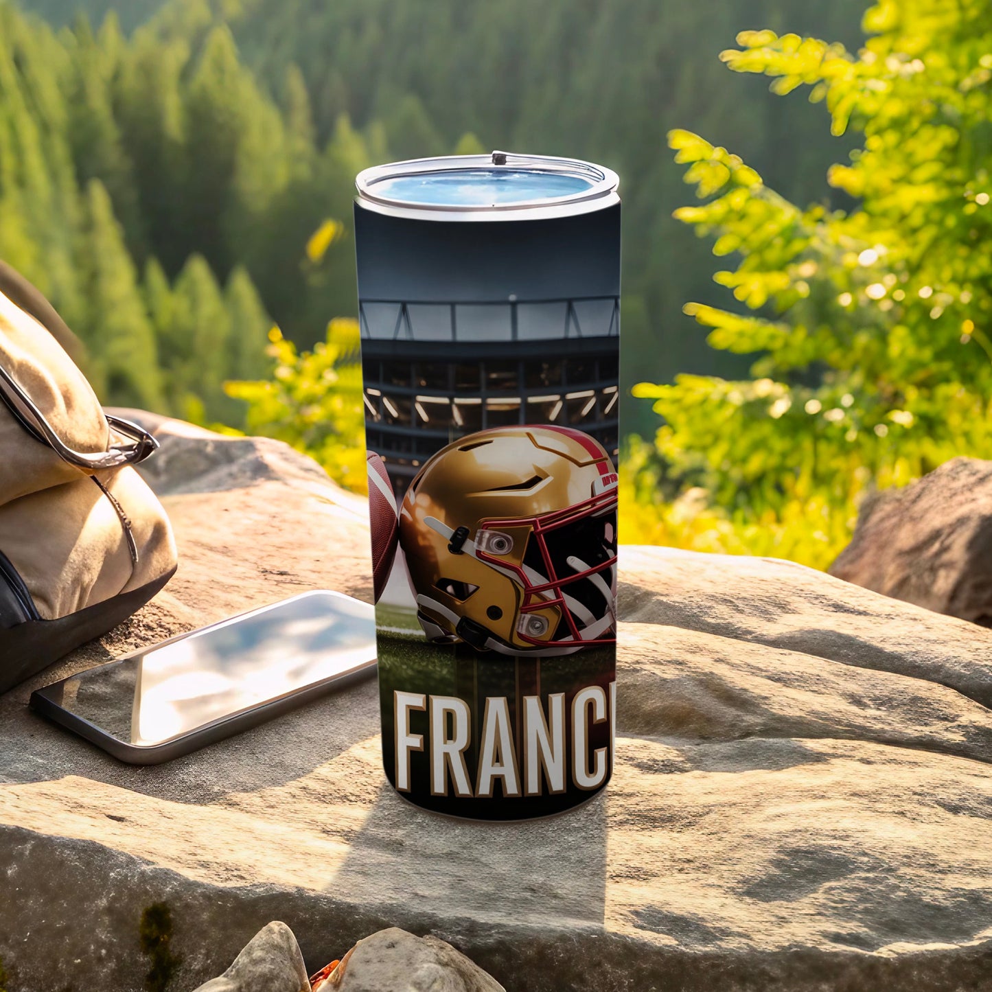 Football helmet and ball on a tumbler with "FRANCE" text.