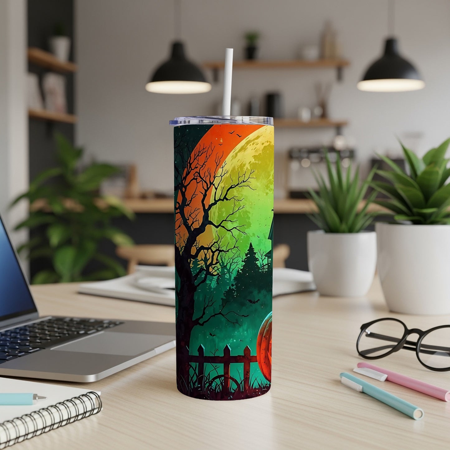 Halloween tumbler with a spooky tree, haunted house, and glowing moon.