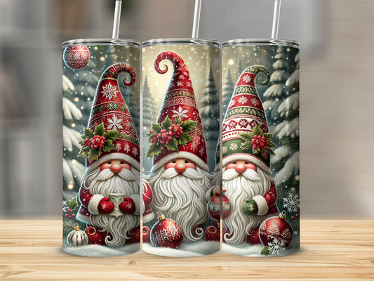 Three gnomes in festive hats and coats hold Christmas ornaments with snowy trees behind them.