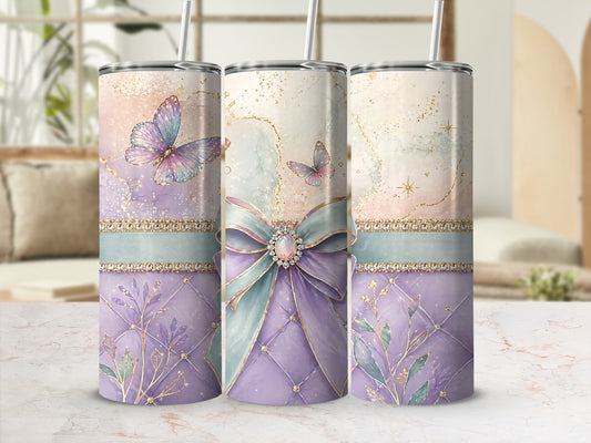 Three tumblers with pastel butterflies, bows, and floral designs.
