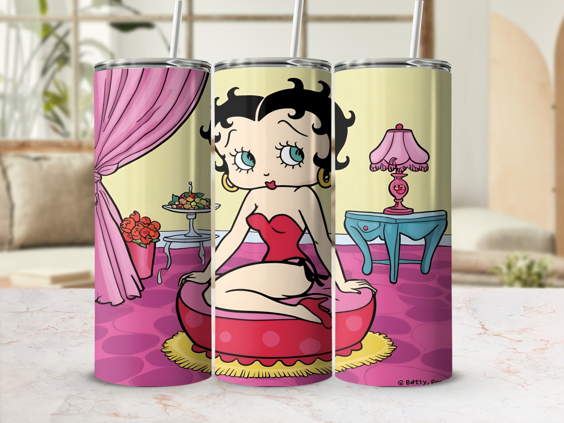 Betty Boop on a pink pouf with floral curtains and a lamp.