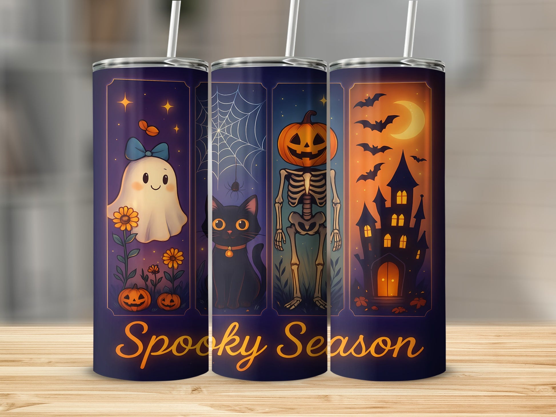 Three tumblers with Halloween designs: ghost, black cat, skeleton, and haunted house.