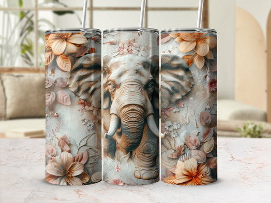 Elephant face surrounded by floral and leaf motifs on a white tumbler.
