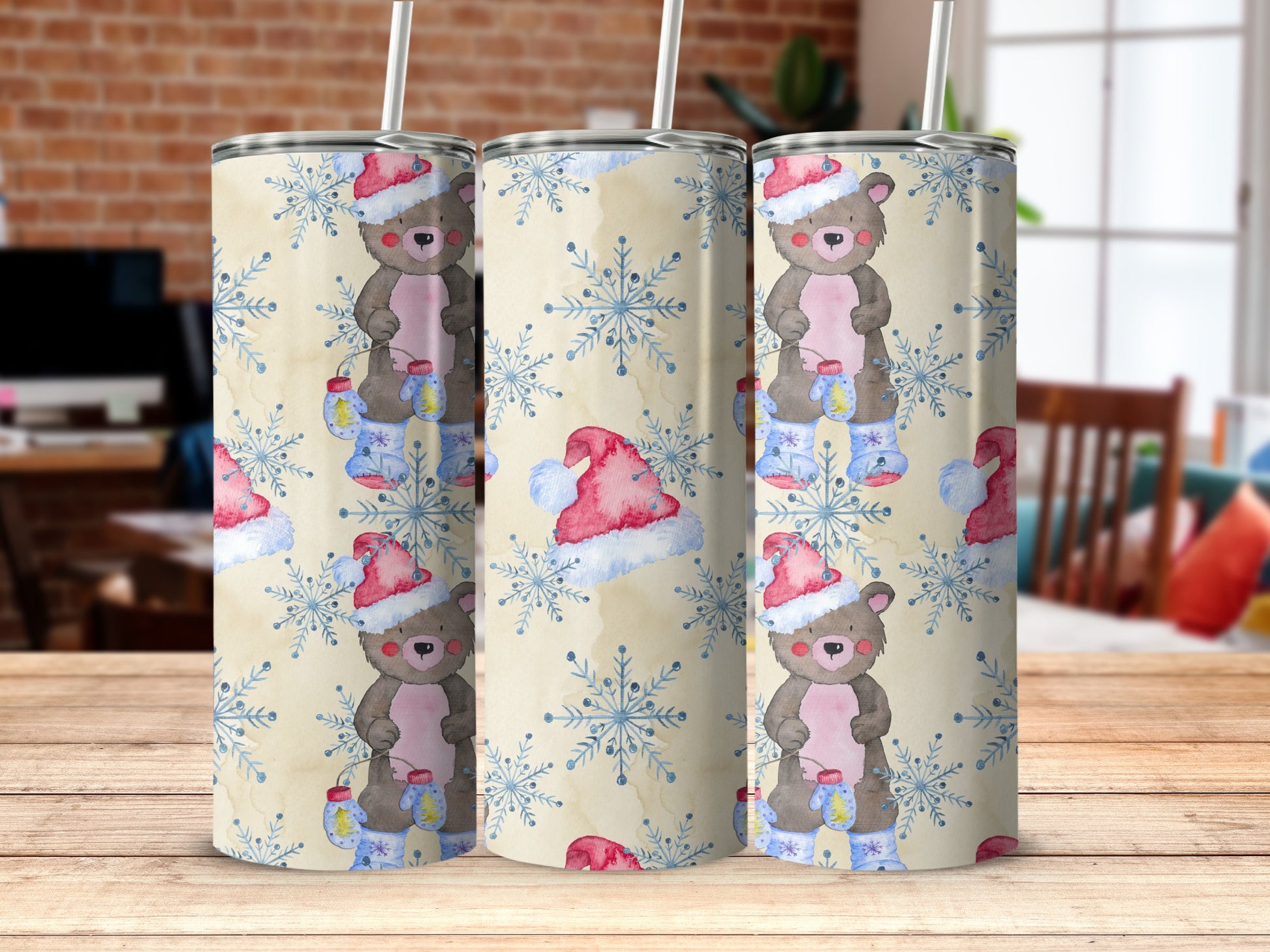 Three tumblers featuring a teddy bear in a Santa hat and snowflakes pattern.