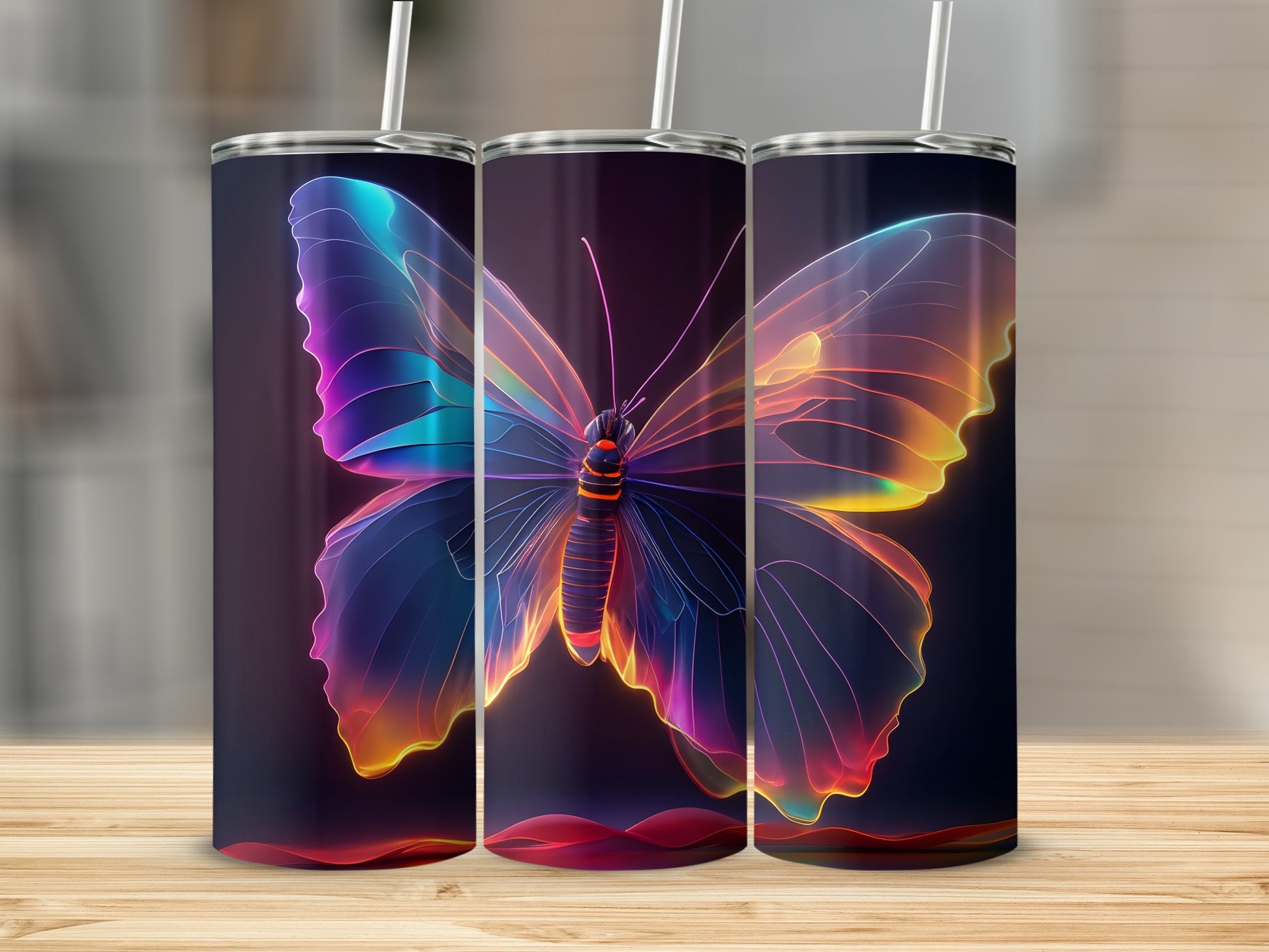 Three tumblers with glowing, colorful butterfly designs on a wooden surface.