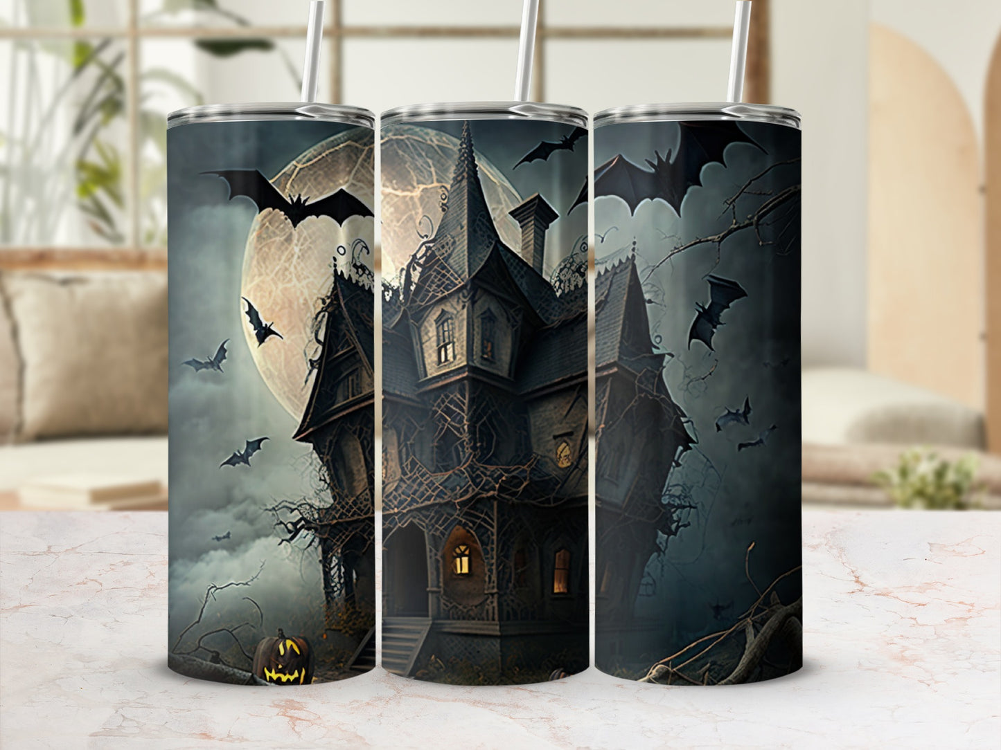 Haunted house with bats and full moon design on three tumblers.
