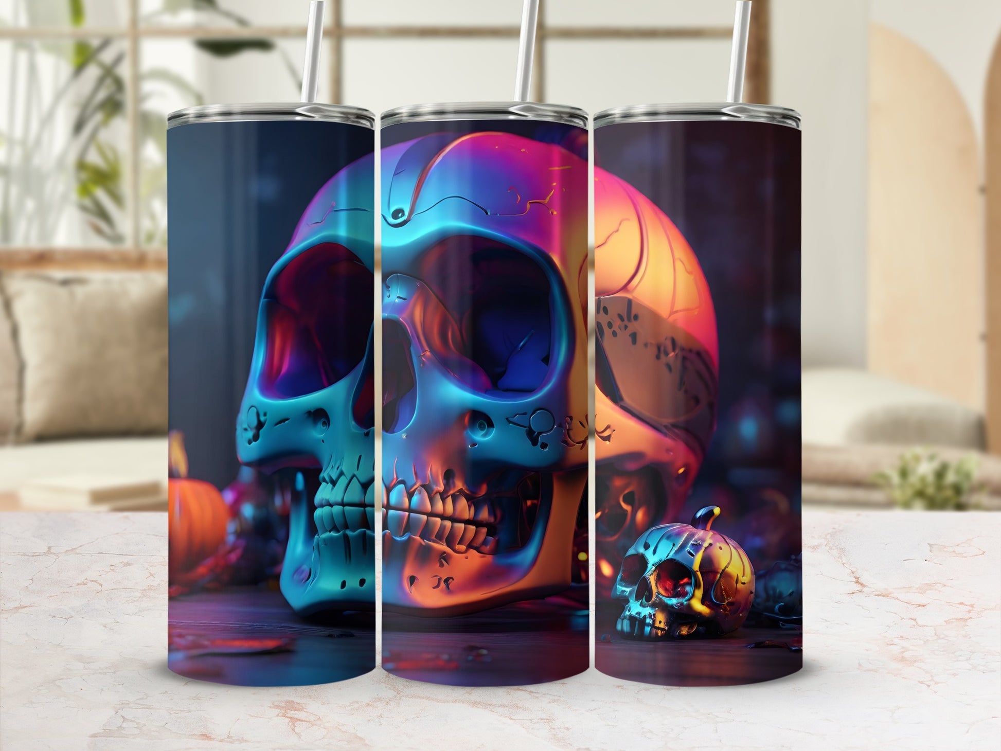 Three colorful, metallic skull tumblers on a patterned surface with pumpkins.