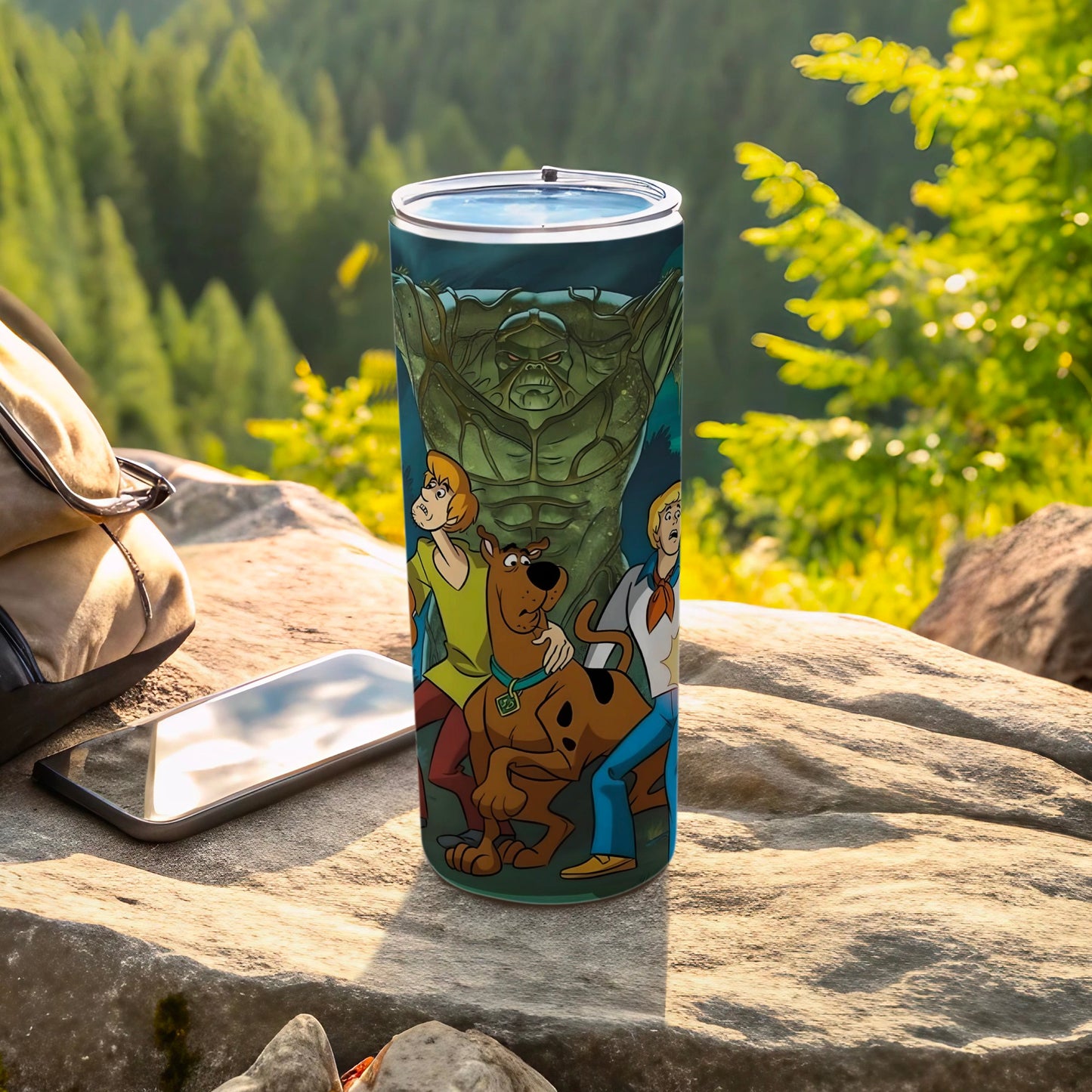 Scooby-Doo characters confront a swamp monster on a green tumbler.