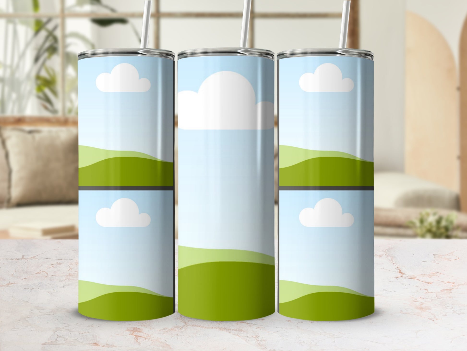 Three tumblers with a blue sky, white clouds, and green rolling hills design.
