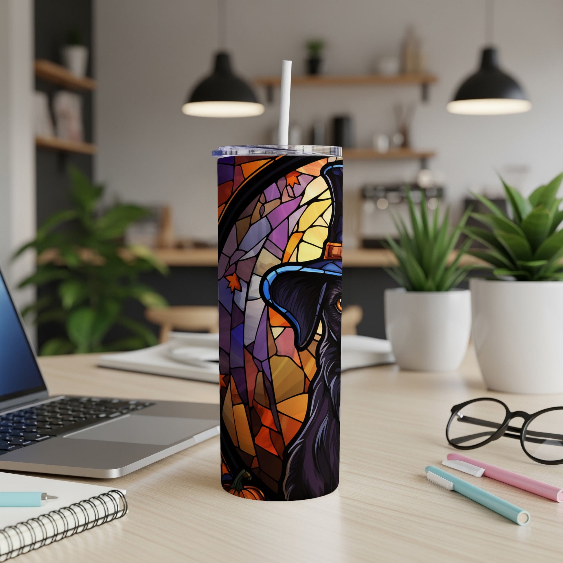 Black dog in witch hat, stained glass style, on a tumbler cup.