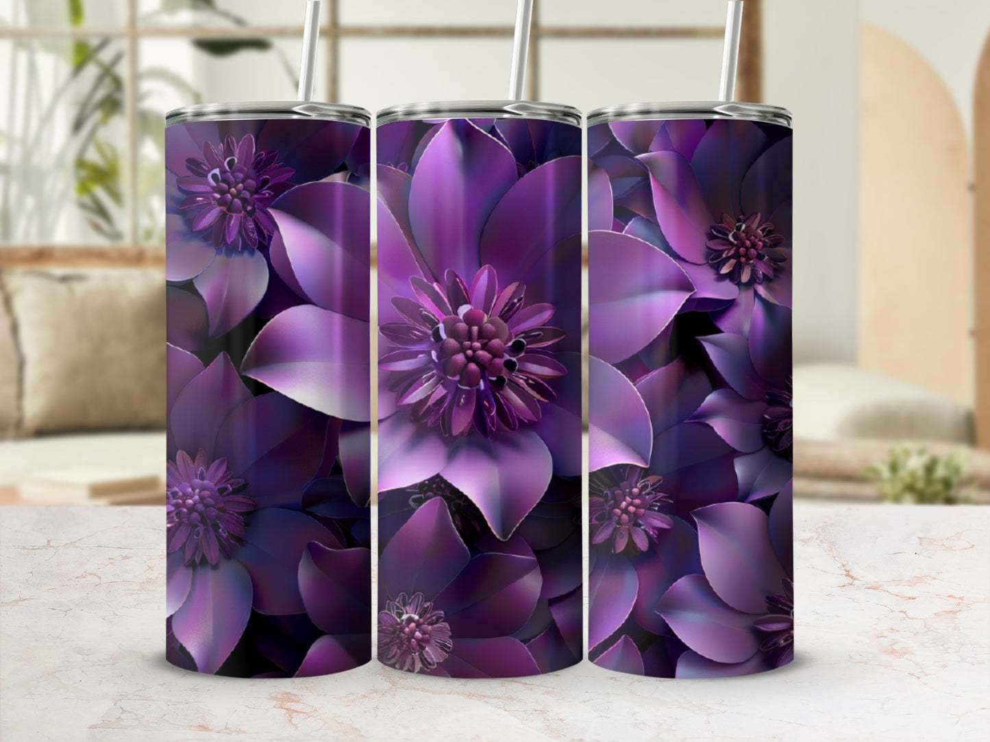 Three purple floral tumblers with straws, displayed on a marble surface.