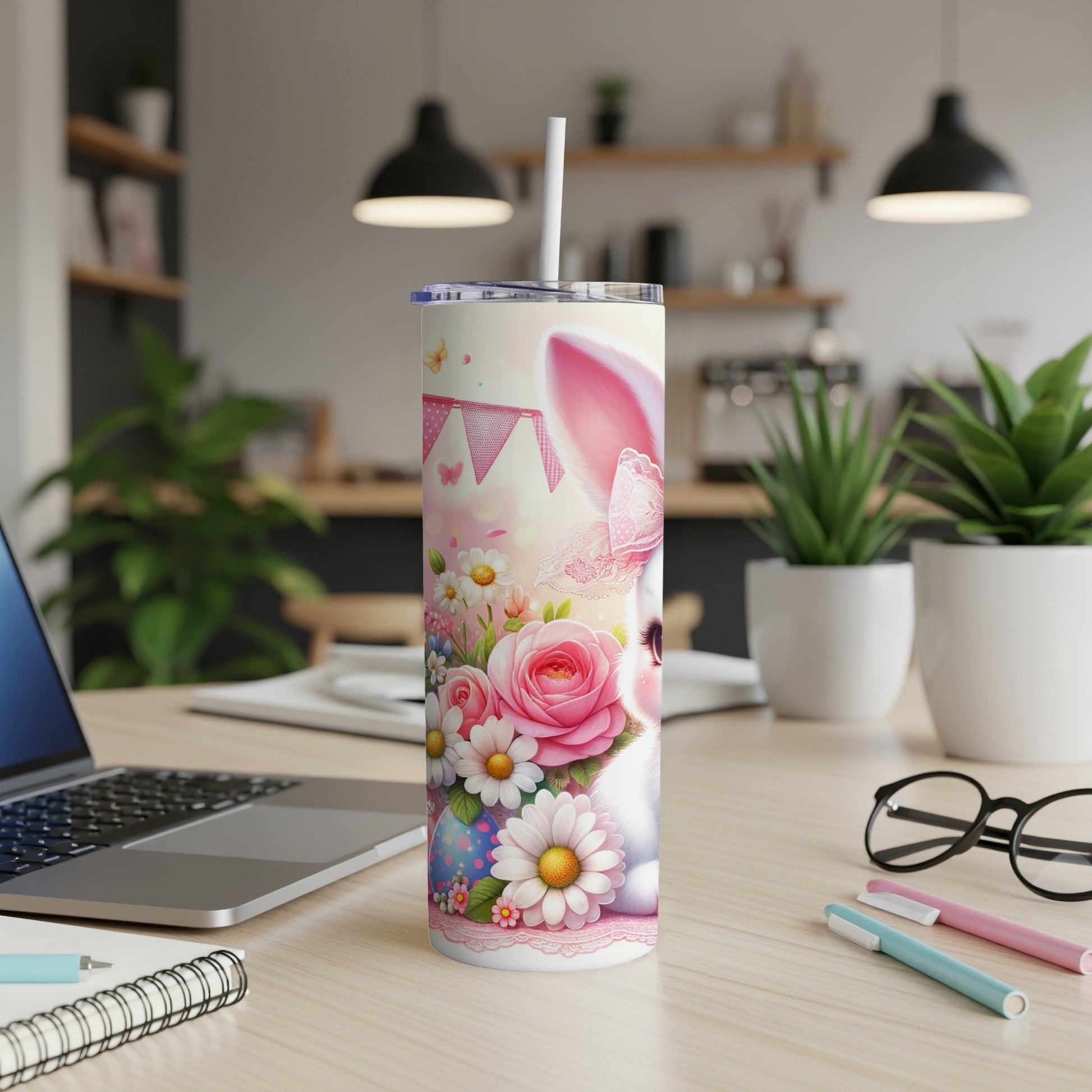 White bunny with pink ears on a floral Easter tumbler with a straw.