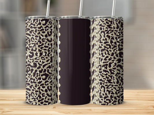 Dark tumbler with leopard print and pearl accents and straw.