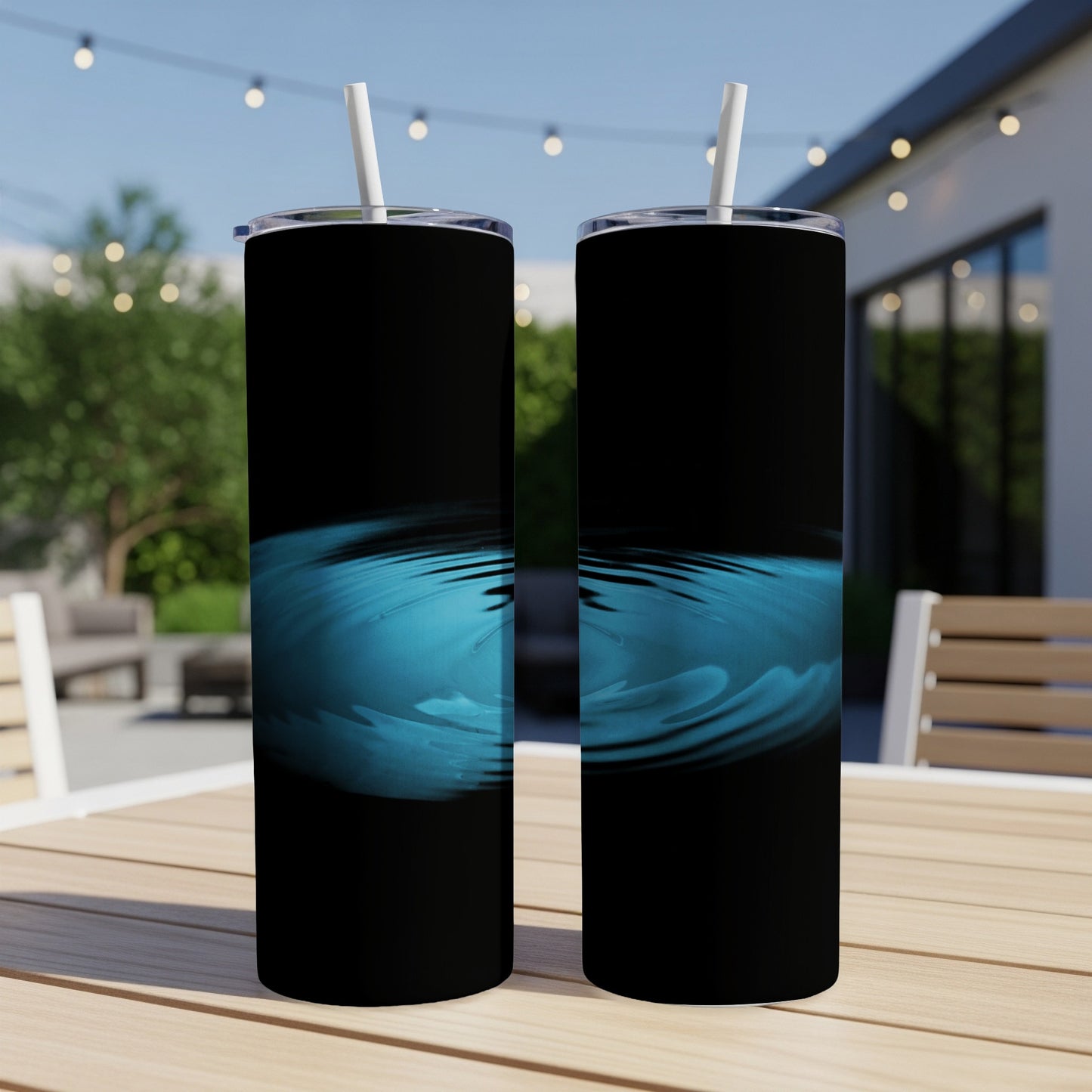 Two black tumblers with a blue water ripple design.
