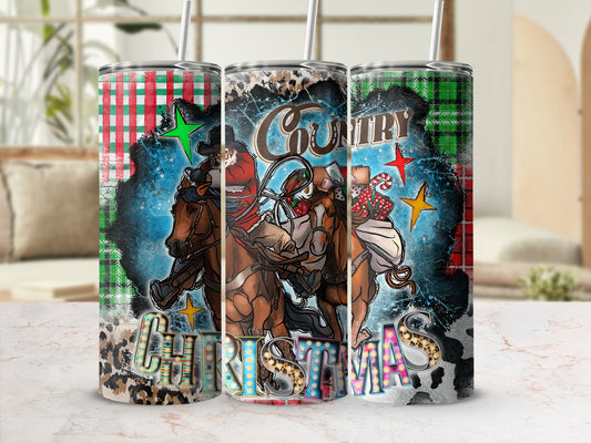 Cowboy Santa rides a horse on a distressed tumbler with "COUNTRY CHRISTMAS" text.