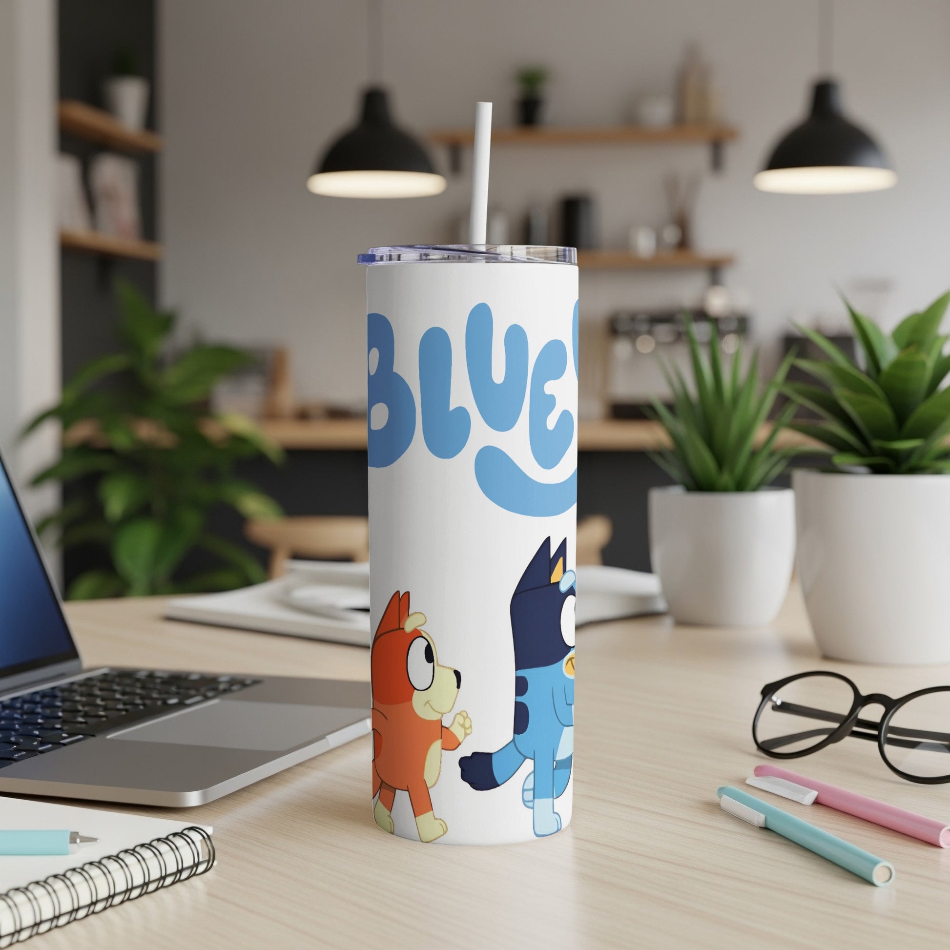Bluey and Bingo characters on a white tumbler with a straw.