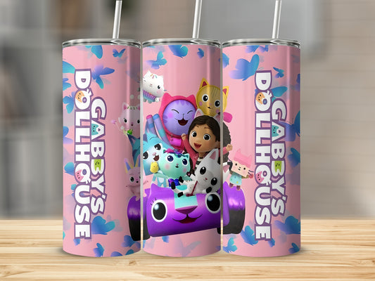 Gabby's Dollhouse characters in a purple car, surrounded by butterflies, on a pink tumbler.