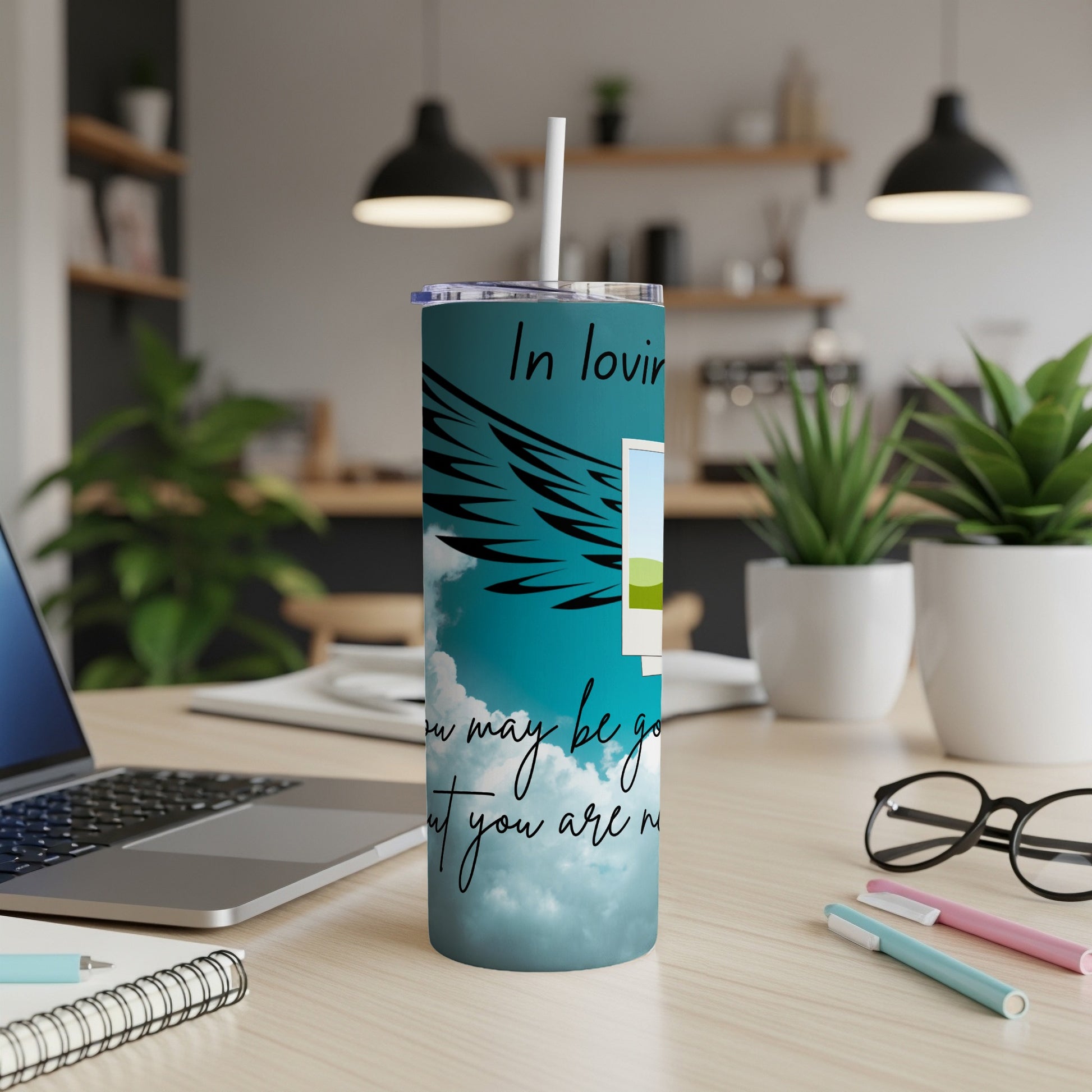 Tumbler with wings, sky, and text "In loving memory, though you may be gone, you are never..."